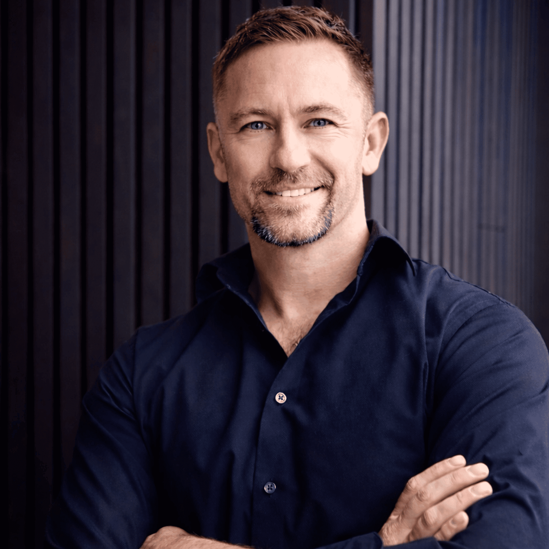 Portrait of Dan Burda, a professional stylist at Studio Raw Elite, showcasing their expertise and style.