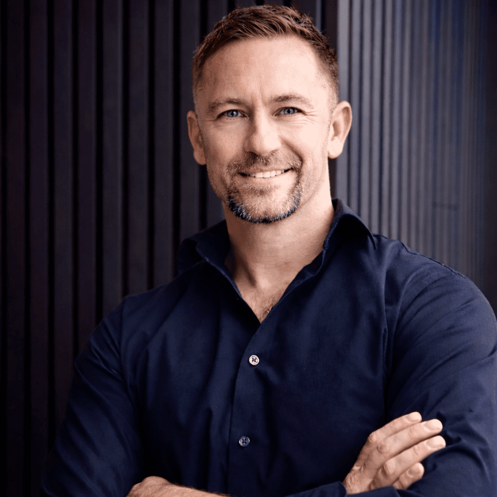 Portrait of Dan Burda, a professional stylist at Studio Raw Elite, showcasing their expertise and style.