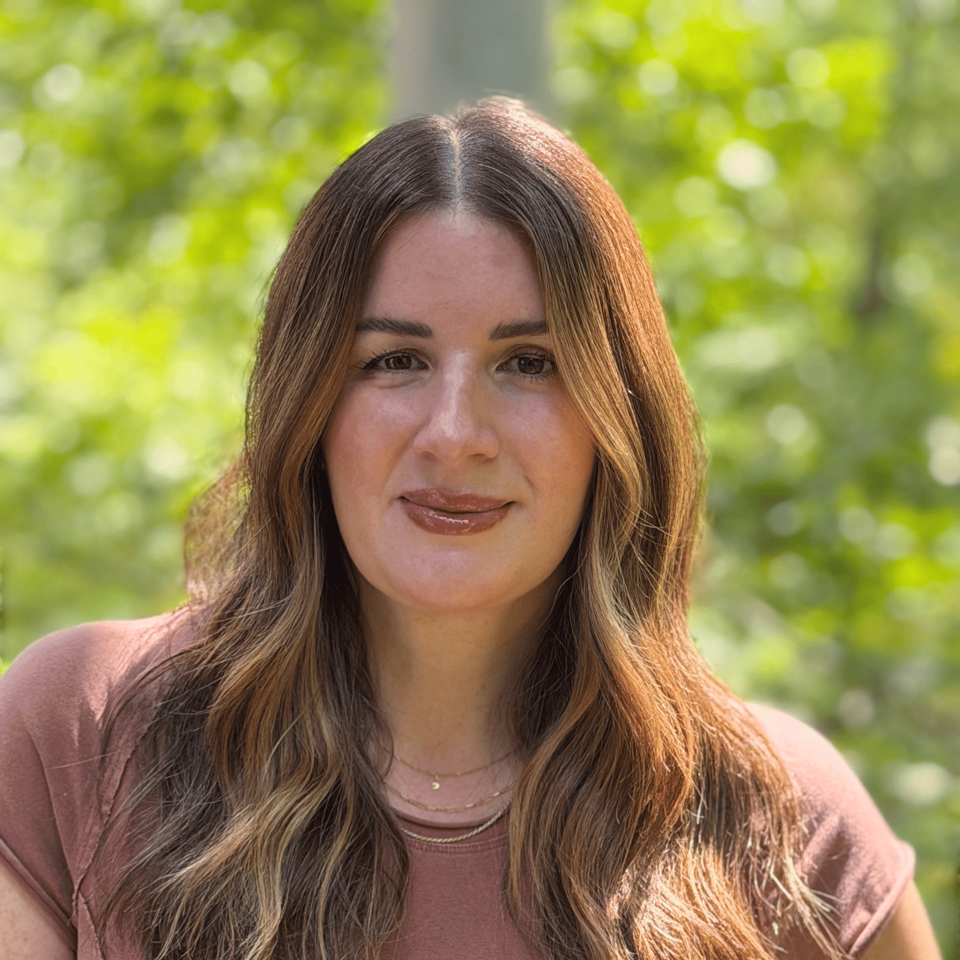 Portrait of Erika, a professional stylist at Studio Raw Elite, showcasing their expertise and style.